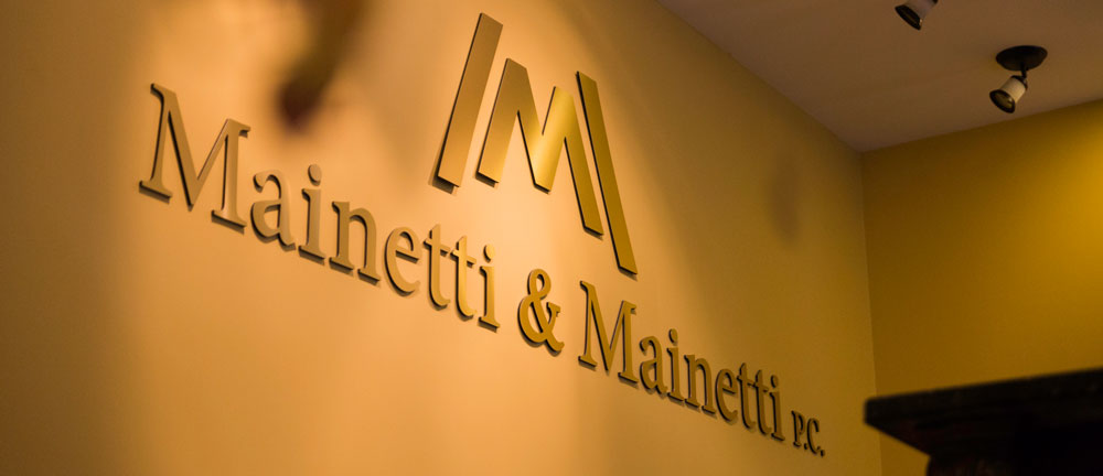 Mainetti & Mainetti lobby sign