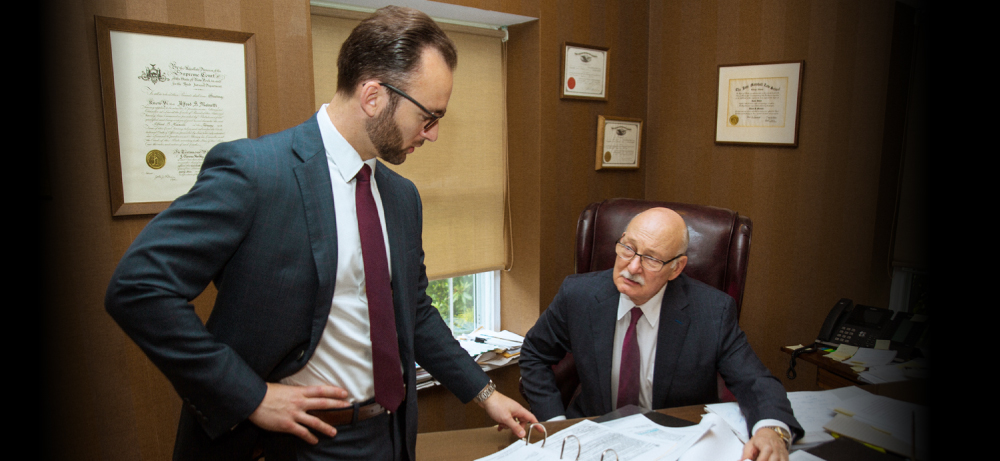 Alex and Alfred Manetti reviewing a case