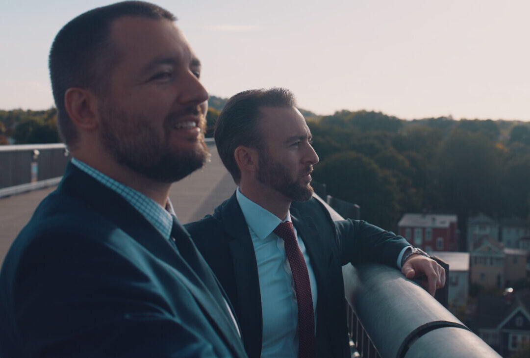 Michael and Alex Manetti looking out over a bridge